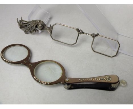 A PAIR OF VINTAGE WHITE METAL FOLDING LORGNETTES, with marcasite embellishment, together with a pair of lucite / plastic fold
