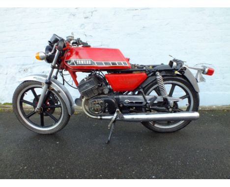 A 1982 YAMAHA RD200 MOTORCYCLE 'BWD 354Y', having red coachwork and chrome mudguards, partially dis assembled but parts are p