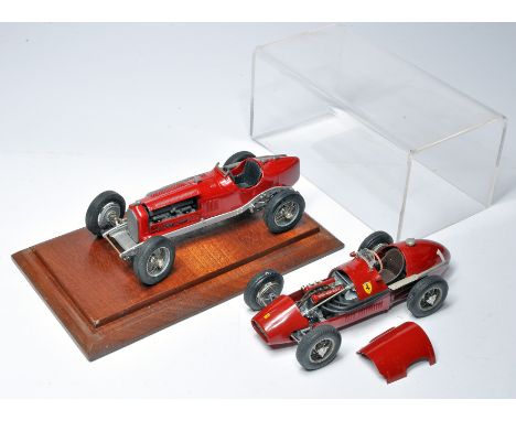 A pair of approx 1/24 metal racing cars comprising a Ferrari and one other, as shown. Some attention required to both, with m
