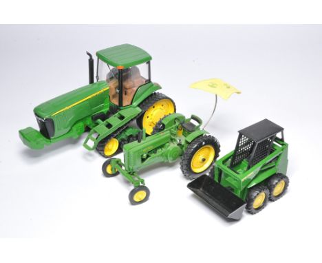 A group of Ertl 1/16 John Deere tractor issues, as shown. Mostly look very good or excellent. 