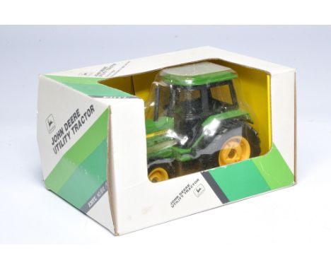 Ertl 1/32 farm model issue comprising No.5512 John Deere Utility Tractor. Excellent and secure in good box -box could do with