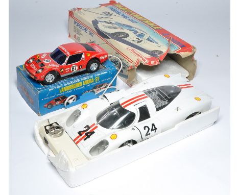 Duo of vintage Remote Control racing cars including Japanese tinplate issue of a Lamborghini Miura plus a Joustra Porsche 917