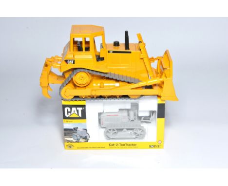 Norscot 1/16 diecast model issue comprising CAT 2-Ton Tracked Tractor, excellent in box. Plus a loose Bruder plastic CAT Bull