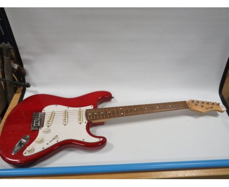 A STAGG ELECTRIC GUITAR IN CHERRY RED PAINT WORK