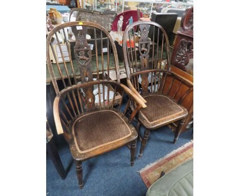 A PAIR OF VINTAGE HOOP BACK CHAIRS WITH LION CARVED DETAIL
