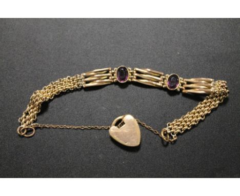 A VICTORIAN ROLLED GOLD BRACELET SET WITH AMETHYST COLOUR STONES