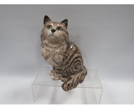 A BESWICK LARGE SWISS ROLL SEATED CAT 