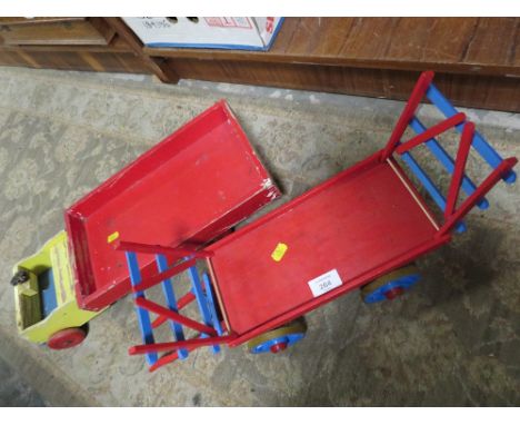 A VINTAGE WOODEN PUSH ALONG TOY LORRY TOGETHER WITH A WOODEN TRAILER
