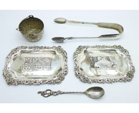 Two silver trays, with import hallmarks, a pair of Victorian silver sugar bows, a strainer and a spoon, (silver 98g) 