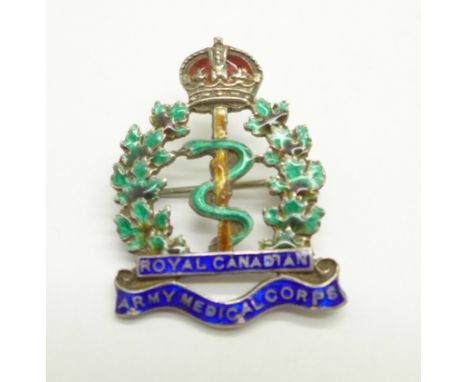 A silver and enamel Royal Canadian Army Medical Corps badge 