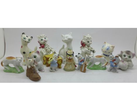A collection of cat figures and one condiment, including Wade, Italian Spaghetti cats, and two with gold anchor, German cat m