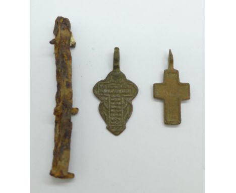 Two Viking bronze crosses and a knife handle, found in Russia 