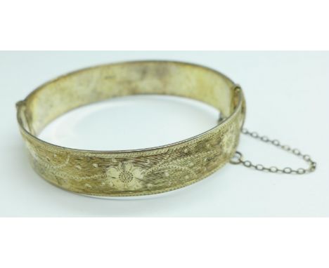 A silver bangle, with inscription dated 1977, 33.5g 