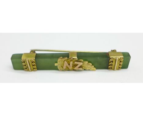 A 9ct gold mounted jade brooch, with New Zealand fern, 51mm 