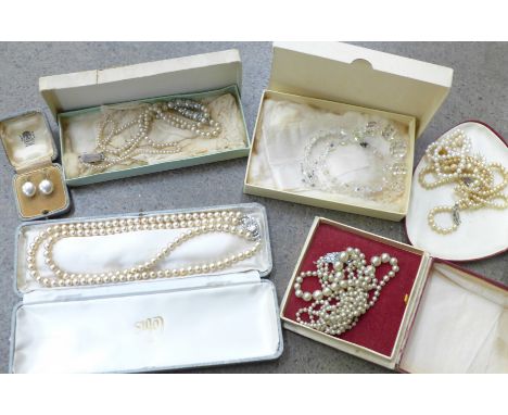 Faux pearl necklaces and a pair of earrings 