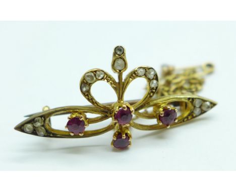 An Arts and Crafts old cut diamond and ruby set brooch, tests as 14/15ct gold, 3.3g, 31mm 