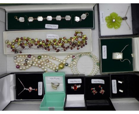A collection of silver jewellery including mother of pearl and red stones 