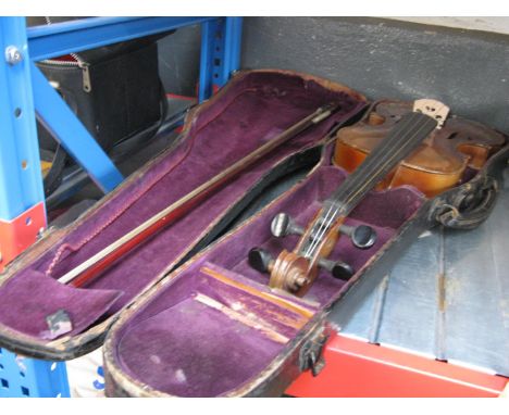 A cased violinCondition: Wear around saddle near end button, some wear with minor scuffing to corners and around ribs, scratc