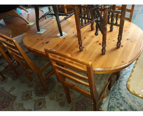 A pine dining table and 4 ladder bak chairs 