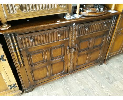 An Ercol priory style sideboard 