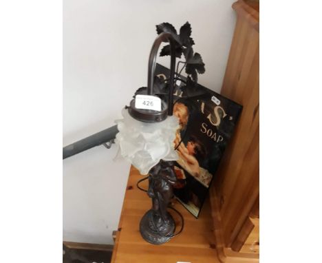 A metal figure lamp with frosted glass shade 