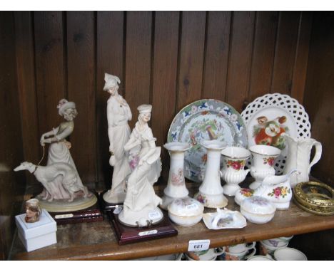 Shelf of china ornaments, figures and plates 