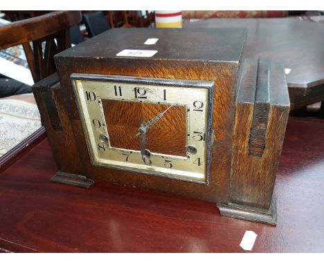 An art deco oak cased mantle clock 