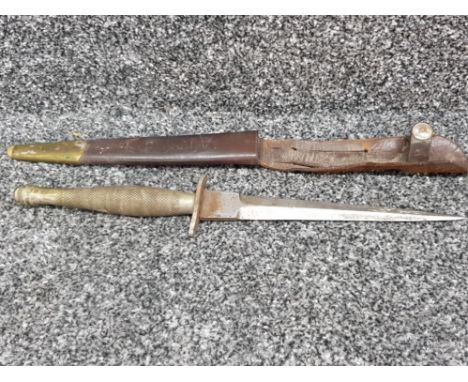 An antique continental dagger (30cm long) with leather and brass scabbard.