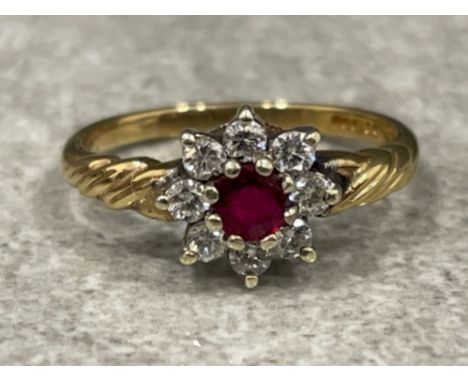 Ladies 9ct gold Ruby and Diamond cluster ring. Comprising of a Round cut Ruby surrounded by 8 round brilliant cut diamonds. S