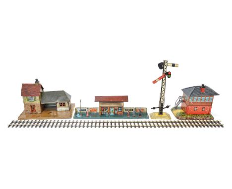 Three Bing tinplate buildings Three Bing tinplate buildings to include a station platform with a picket fence and many early 