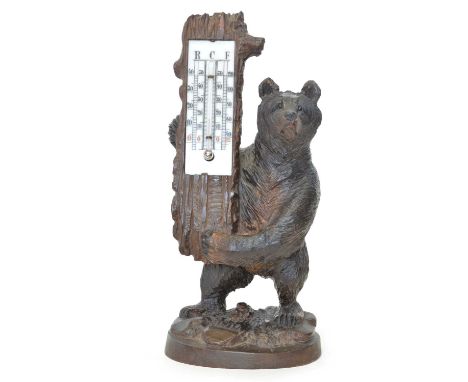 Black Forest Carved Bear Thermometer Early 20th Century Swiss black forest carved bear holding a thermometer in the form of a