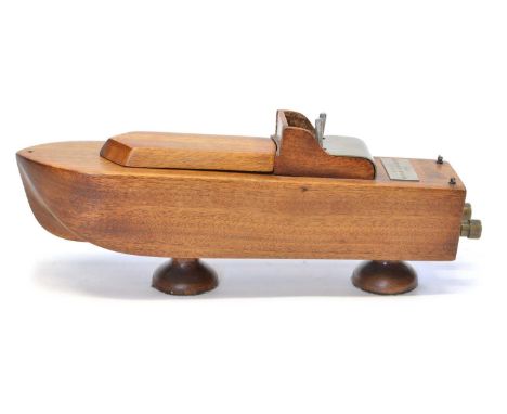 Ship Cigarette Dispenser Mid 20th Century cigarette dispenser in the form of a ship with trigger mechanism to fire two cigare