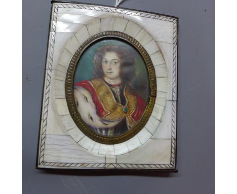 A 19th century miniature on ivory depicting a portrait of a gentleman wearing a tunic, signed.