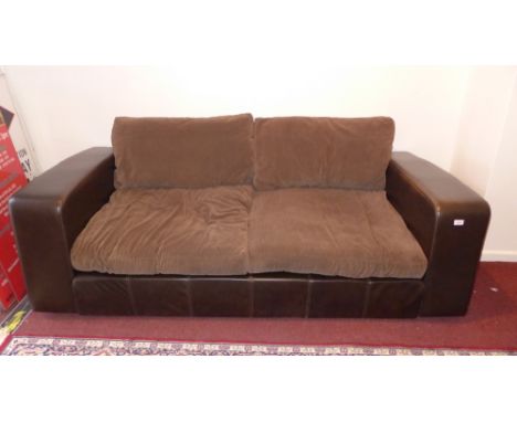 A contemporary two seater brown leather sofa