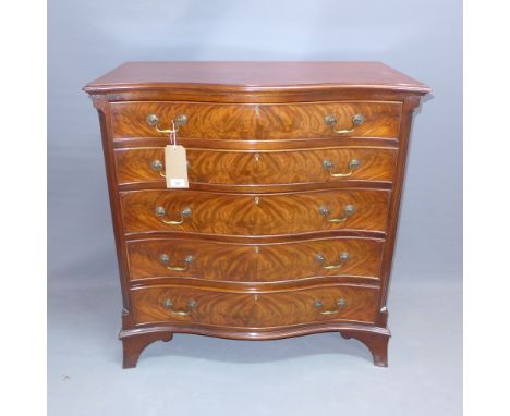 An early 20th Century mahogany serpentine fronted chest of five graduated drawers, raised on carved bracket feet. H-91cm, W-8