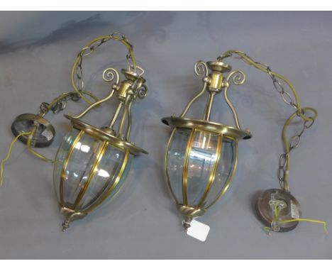 A pair of brass lantern light shades with bevelled glass panels