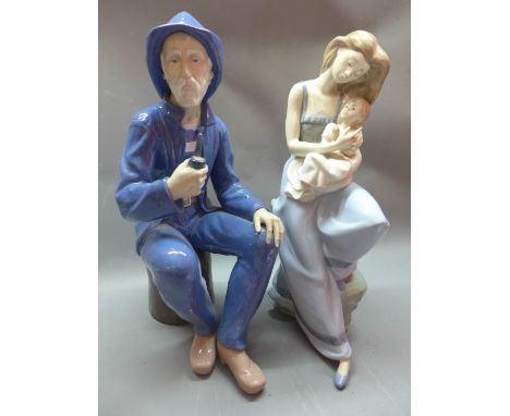 A large Nao figure of a lady hugging a child and a large Nao figure of a fisherman smoking a pipe 