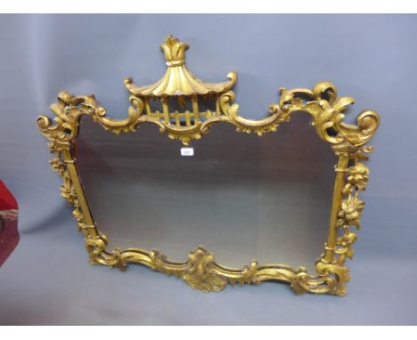 A 19th Century giltwood over mantel mirror in the Chippendale manner with carved and pierced floral border having pagoda top.