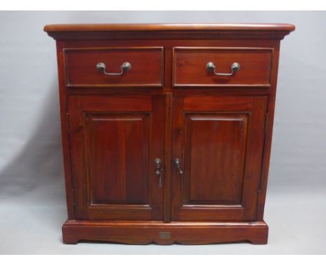 A contemporary mahogany side cabinet with two drawers over two cupboard doors raised on bracket feet. H-75cm W-75cm D-28cm