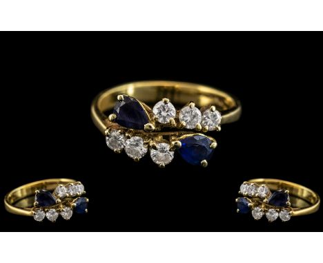 18ct Gold - Good Quality Sapphire and Diamond Set Dress Ring. Marked 750 - 18ct. The Round Brilliant Cut Diamonds of Commerci