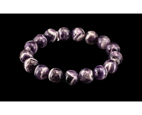 Banded Bi-Colour Amethyst Bracelet, The Natural Elements Being Purple and White, The Beads Threaded on Strong Jewelers Elasti