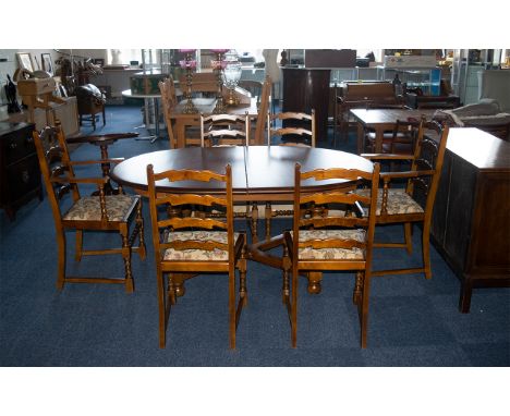 Teak Pull-Out Dining Table on baluster-shaped legs with cross stretchers.  64" long x 28" high x 42" wide, with a set of six 