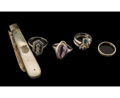 Four Vintage Silver Rings with amethysts and marcasites, plus a mother-of-pearl fruit knife (5)