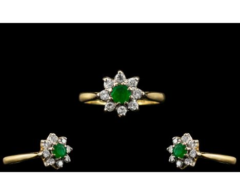 18ct Gold Emerald And Diamond Cluster Ring, Central Round Cut Emerald Surrounded By 8 Round Brilliant Cut Diamonds, Stamped 1