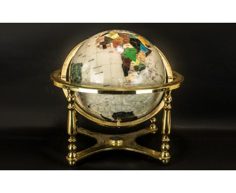 A Reproduction Table Brass Mounted World Globe, gem set style, on a gimble with a compass to the base.  Globe diameter approx