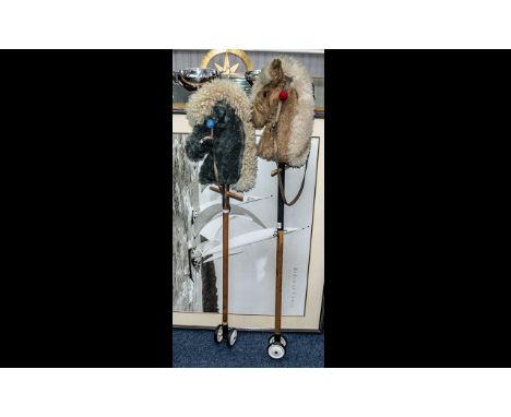 Pair of Vintage 1960s Child's Hobby Horses on poles, terminating on wheels.  Measure 43" in length.  