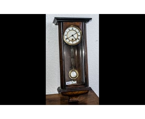 Small Vienna Wall Clock in Glazed Walnut Case, c1890s; white enamel dial with one key aperture, R-A pendulum, 24 inches (60cm