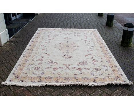 A Genuine Excellent Quality Iranian Cream Ground Carpet/Rug. Decorated throughout in a bespoke floral design. As new conditio