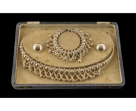 A Boxed Vintage Set of Elizabethan Faux Pearls, consisting of a necklace, earrings and bracelet.  Circa 1930s.  Box size 9" x