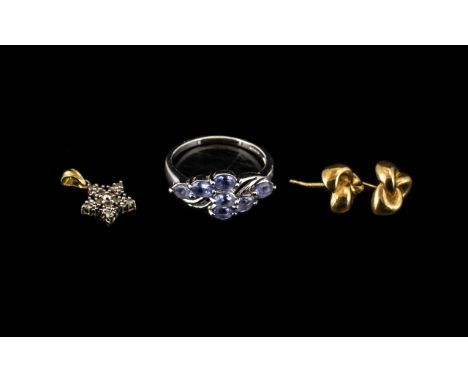 Small Collection of 9ct Gold Jewellery, to include a pair of knot style stud earrings, a diamond star pendant, and a white go